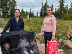 Family in Sweden picking up trash.